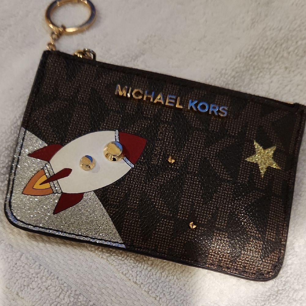Michael Kors Black Wristlet with Rocket and Star Design